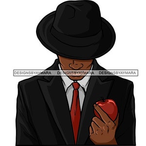 May include: A man wearing a black suit and a black fedora hat holds a red apple in his right hand.