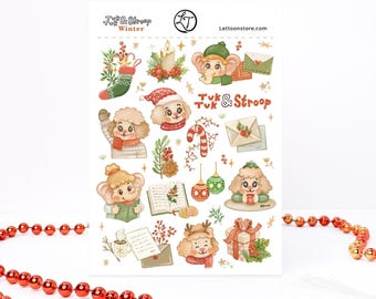 May include: A sticker sheet titled Tuk & Stroop Winter featuring illustrations of cartoon dogs, an elephant, a candy cane, Christmas ornaments, a gift, a candle, envelopes, and an open book with holly, all in a soft, festive color palette.