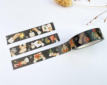 May include: A roll of black washi tape and two strips of the same tape featuring illustrations of hands interacting with holiday items like candles, ornaments, candy canes, snowflakes, and gifts against a dark, starry background.