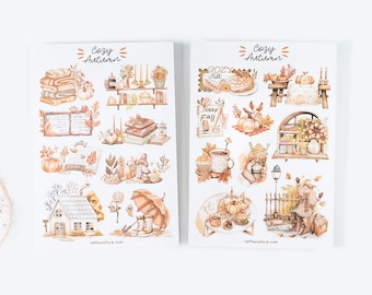 May include: Two sheets of stickers with a cozy autumn theme. The stickers feature illustrations of pumpkins, books, mugs, houses, and other fall-themed imagery. The stickers are printed on white paper with a brown and orange color scheme.