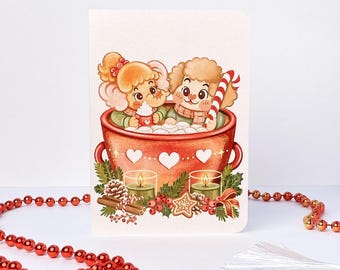 May include: A greeting card featuring an illustration of a cartoon elephant and a lamb sitting inside a large red mug filled with marshmallows. The mug is decorated with white hearts and surrounded by green pine branches, two lit candles, cinnamon sticks, and a candy cane.