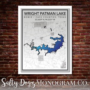 May include: A black and white map of Wright Patman Lake in Bowie and Cass Counties, Texas. The lake is highlighted in blue and the coordinates are 33.2659° N, 94.2231° W. The text "Salty Dogz MONOGRAM CO." is at the bottom of the map.