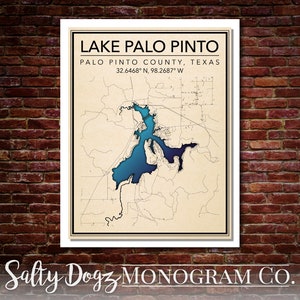 May include: A vintage-style map of Lake Palo Pinto in Palo Pinto County, Texas. The map shows the lake in blue and the surrounding area in beige. The coordinates 32.6468° N, 98.2687° W are printed below the lake name. The text "Salty Dogz MONOGRAM CO." is printed at the bottom of the map.