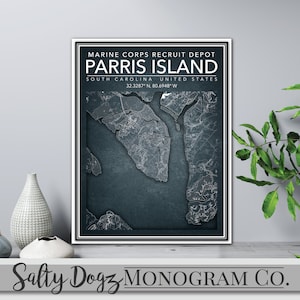 May include: A framed print of a map of Parris Island, South Carolina, with the text "Marine Corps Recruit Depot Parris Island, South Carolina, United States, 32.3287° N, 80.6948° W" and the text "Salty Dogz Monogram Co."
