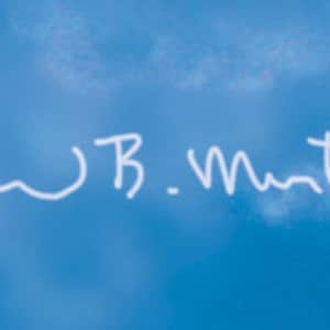 May include: White signature on a blue background with the text "Dan B. Martin 1/18/50"