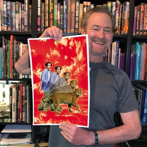 May include: A red and white print with a collage of three men and three jaguars. The men are wearing blue shirts and the jaguars are walking on a red background with white clouds.