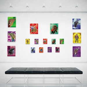 May include: A gallery wall display of 15 framed art prints featuring various colorful and abstract designs. The prints are arranged in a grid pattern on a white wall. A black bench sits in front of the wall.