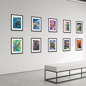May include: A gallery wall display of nine framed art prints featuring colorful, whimsical illustrations of people and animals. The prints are arranged in a grid pattern on a white wall.