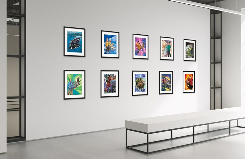 May include: A gallery wall display of nine framed art prints featuring colorful, whimsical illustrations of people and animals. The prints are arranged in a grid pattern on a white wall.