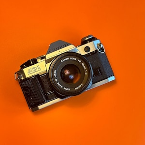 Canon AE-1 Program 35mm film camera | Canon 50mm 1:2 nFD lens |