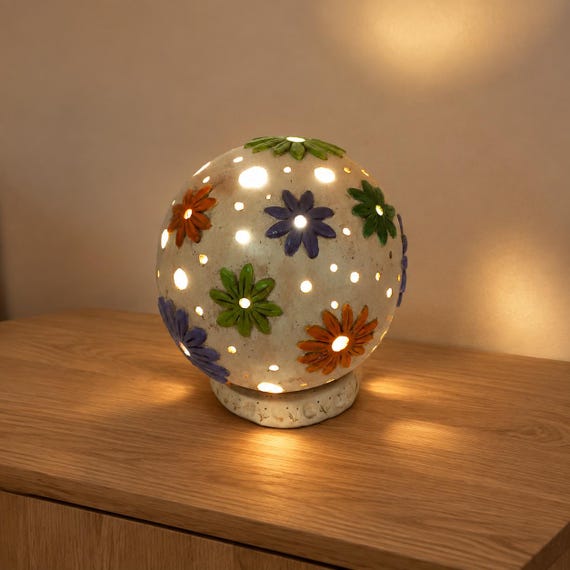 A handmade stoneware ceramic table lamp that doubles as a sculptural art object — the kind of one-of-a-kind piece that becomes the first thing guests ask about.