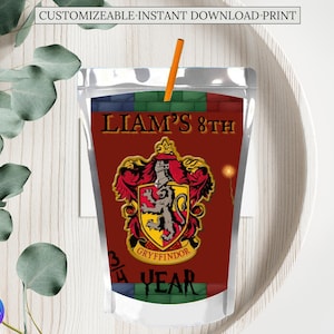 May include: A red, white, and gold juice box with a Harry Potter theme. The box has a Gryffindor crest with a lion and the text "Liam's 8th Year".