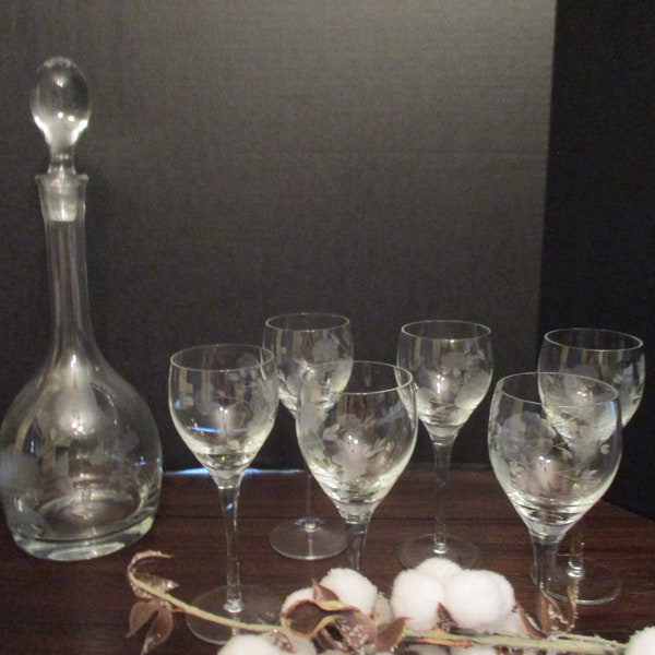 Vintage wine decanter set with, six matching wine glasses, etched design