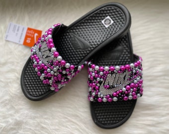 pink and orange nike slides