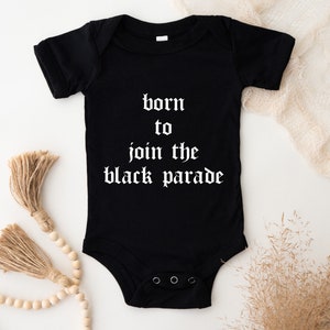 May include: Black baby onesie with white text that reads "born to join the black parade".