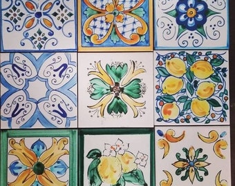 9 pieces Sicilian ceramic tiles with assorted decorations.