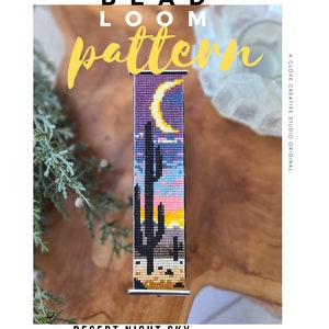 May include: A bead loom pattern for a bracelet featuring a desert night sky scene with a crescent moon, stars, and cacti. The pattern is in shades of purple, pink, yellow, and blue.
