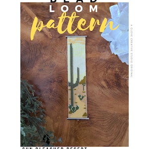 May include: A bead loom pattern for a bracelet with a desert landscape design. The pattern features a cactus and other desert elements in shades of green, tan, and yellow. The text "BEAD LOOM pattern" is at the top, and "SUN BLEACHED DESERT BRACELET PATTERN" is at the bottom.