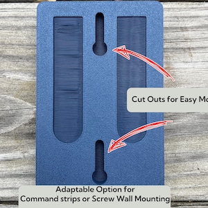 May include: A blue wall mount with cutouts for easy mounting. The text "Adaptable Option for Command strips or Screw Wall Mounting" is printed below the mount.