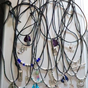 Charm and Gemstone Necklaces with various designs including guitars