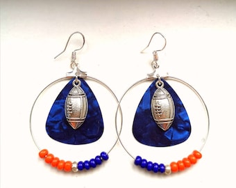 Football resting on blue guitar pick w matching Chicago Bears football color beads on Silver Hoops with football. Other teams available