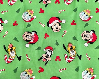 Disney Mickey Mouse and Friends Holiday Icons Green Cotton Fabric available by fat quarter 18"x21" / Remnant 15"x42"