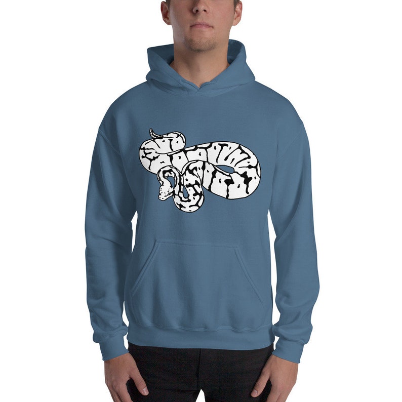 May include: A blue hooded sweatshirt featuring a white and black graphic of a snake. The snake design is centered on the front of the sweatshirt. The sweatshirt has a kangaroo pocket and a drawstring hood.