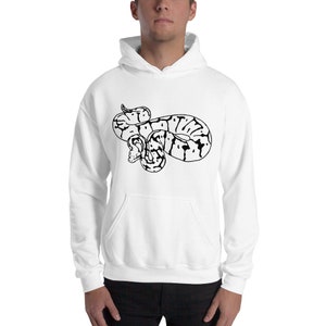 May include: White hooded sweatshirt featuring a black and white graphic of a coiled snake. The snake design is centered on the front of the sweatshirt. The sweatshirt has a front pocket and a drawstring hood.