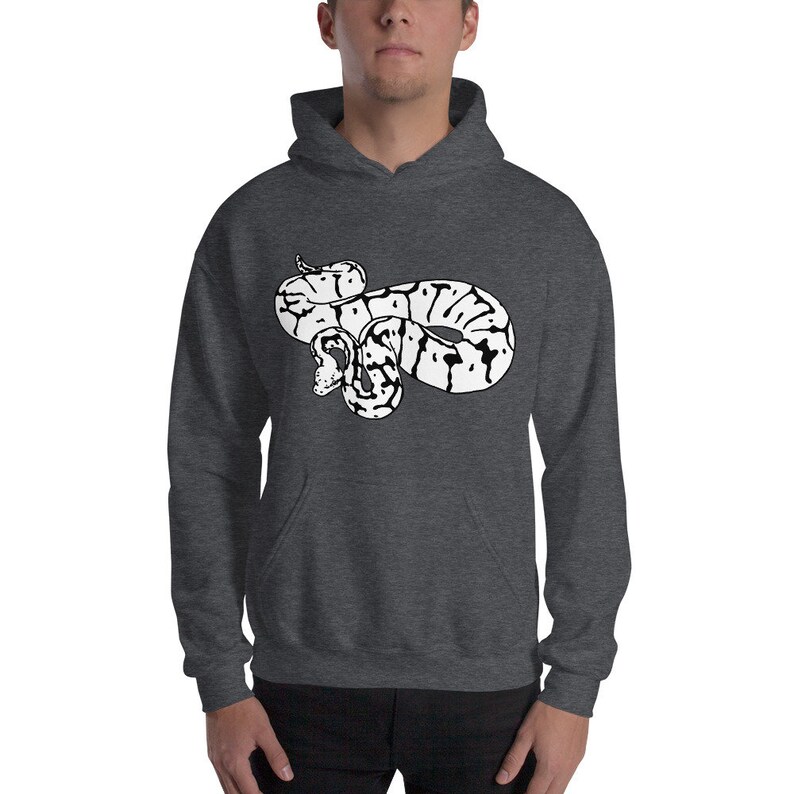 May include: Dark gray hoodie featuring a white and black graphic of a snake. The snake design is centered on the front of the hoodie. The hoodie has a drawstring hood and a front pocket.