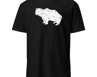 May include: Black t-shirt featuring a white illustration of a bear. The bear is depicted in a side profile, with detailed fur and a standing posture. The shirt is made of a soft material.