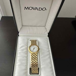 Vintage Movado Gold Plated Women&#39;s Watch with Roman Numerals Oval White Face Honeycomb Bracelet With Original Box
