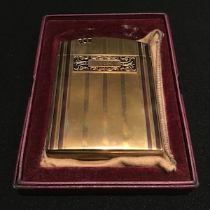 Estuche y encendedor vintage Ronson Gold Art Metal Works de veinte años con esmalte de nogal. Encendedor y pitillera de colección con caja original.