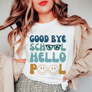 May include: White t-shirt with a blue, green, and yellow graphic that says "Good Bye School Hello Pool" with sunglasses and smiley faces.