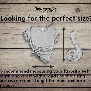 May include: A gray t-shirt on a wood background with a measuring tape. The text "Looking for the perfect size?" is at the top of the image. The text "We recommend measuring your favorite t-shirt (length and chest width) and use the sizing chart as reference to get the most accurate size for you." is at the bottom of the image.
