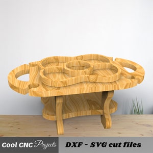 May include: Wooden serving tray with multiple compartments and handles. The tray is on a stand with four legs. The tray is made of light brown wood.  DXF - SVG cut files.