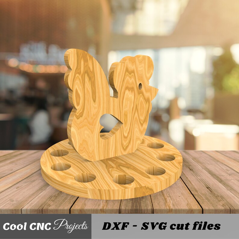 K&ouml;nnte beinhalten: H&uuml;hner-Eierhalter aus Holz mit 10 L&ouml;chern f&uuml;r Eier. Das Huhn steht auf einem runden Sockel. DXF - SVG Schnittdateien.