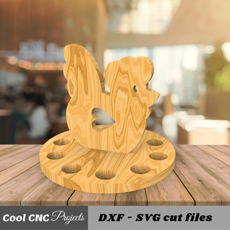 K&ouml;nnte beinhalten: Eierhalter aus Holz in Form eines Huhns mit 6 L&ouml;chern f&uuml;r Eier. Das Huhn steht auf einem runden Sockel. DXF - SVG Schnittdateien.