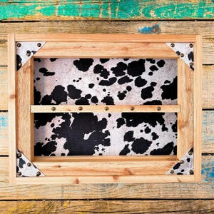 Belt Buckle Display Case - Faux Cowhide Hair Background