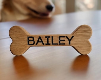 Personalised wooden dog bone with name carved in solid oak