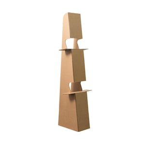 May include: A tall, brown cardboard display stand with a unique, tiered design. The stand features a series of shelves and cut-out sections, creating an eye-catching structure. The stand is made of corrugated cardboard and is suitable for retail or promotional use.