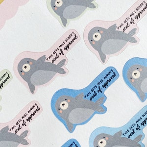 May include: A set of colorful seal stickers with the text "This gets Miss Oliver's seal of approval" on each sticker. The seals are in various poses and have a cute cartoon style.