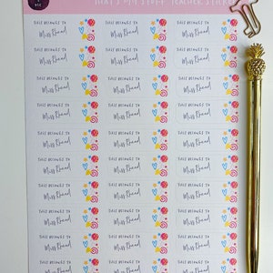 May include: A sheet of colourful teacher stickers with the text "That's My Stuff Teacher Sticker" and "This Belongs to Miss Rhead" repeated on each sticker. The stickers feature a whimsical design with stars, hearts, and swirls.