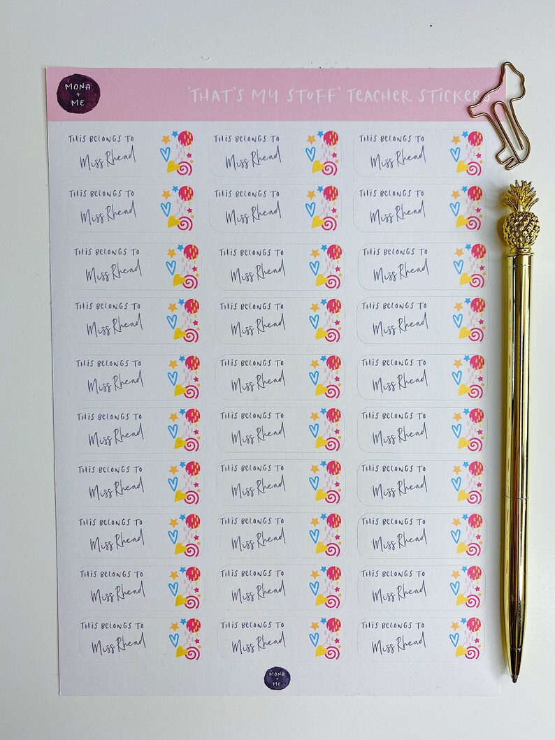 May include: A sheet of colourful teacher stickers with the text "That's My Stuff Teacher Sticker" and "This Belongs to Miss Rhead" repeated on each sticker. The stickers feature a whimsical design with stars, hearts, and swirls.