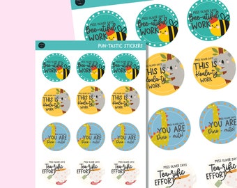May include: A set of 12 colorful round stickers with various animal illustrations and puns. The stickers feature a bee, koala, and dinosaur with phrases like "Bee-utiful Work" and "Koala-ty Work".