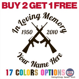 May include: A white decal with the text "BUY 2 GET 1 FREE" in red. The decal features crossed rifles, the text "In Loving Memory", dates 1950 and 2010, and space for a name. It also says "17 COLORS OPTIONS".