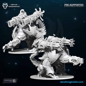 May include: Two detailed, gray, pre-supported miniature figures of a mechanical creature with large cannons. The figures are on a white base, with the text "DEN OF IMAGINATION" and "PRE-SUPPORTED". The figures are compatible with "ONE PAGE RULES".