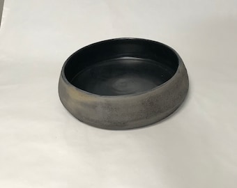 Dark colored flower container
