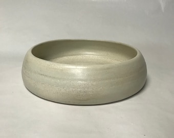 Light colored low flower container