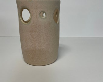 Contemporary white vase with holes