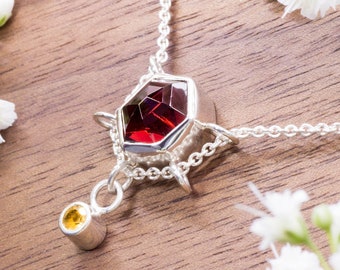 Necklace in sterling silver with red garnet and citrin gemstone. Sustainable and ethical sourced jewelry. Handmade in Bali. Gift for her!